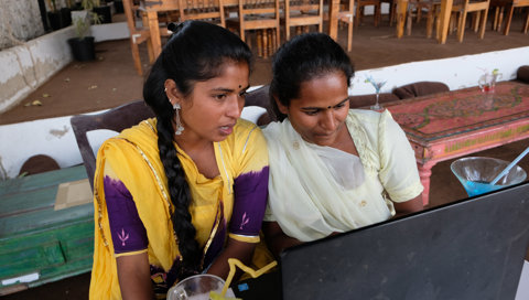 Shallow Focus Of Two Indian Women Looking At A Lap 2023 11 27 05 03 06 Utc